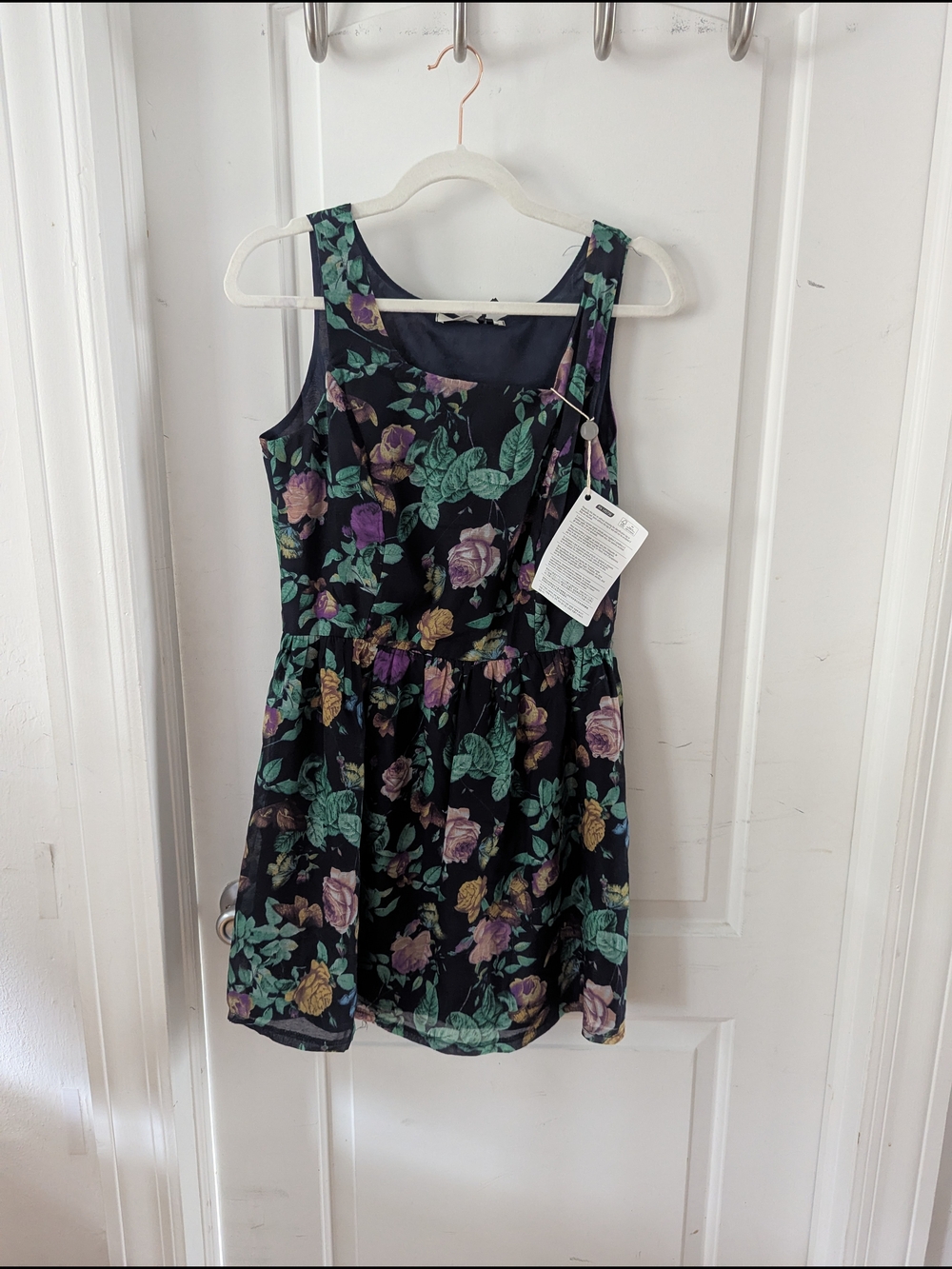 Sleeveless Floral Mini Dress in Black with Green & Purple Print